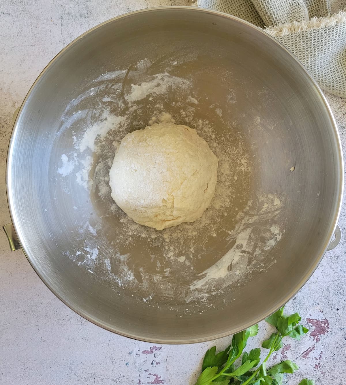 ball of floured dough in a bowl