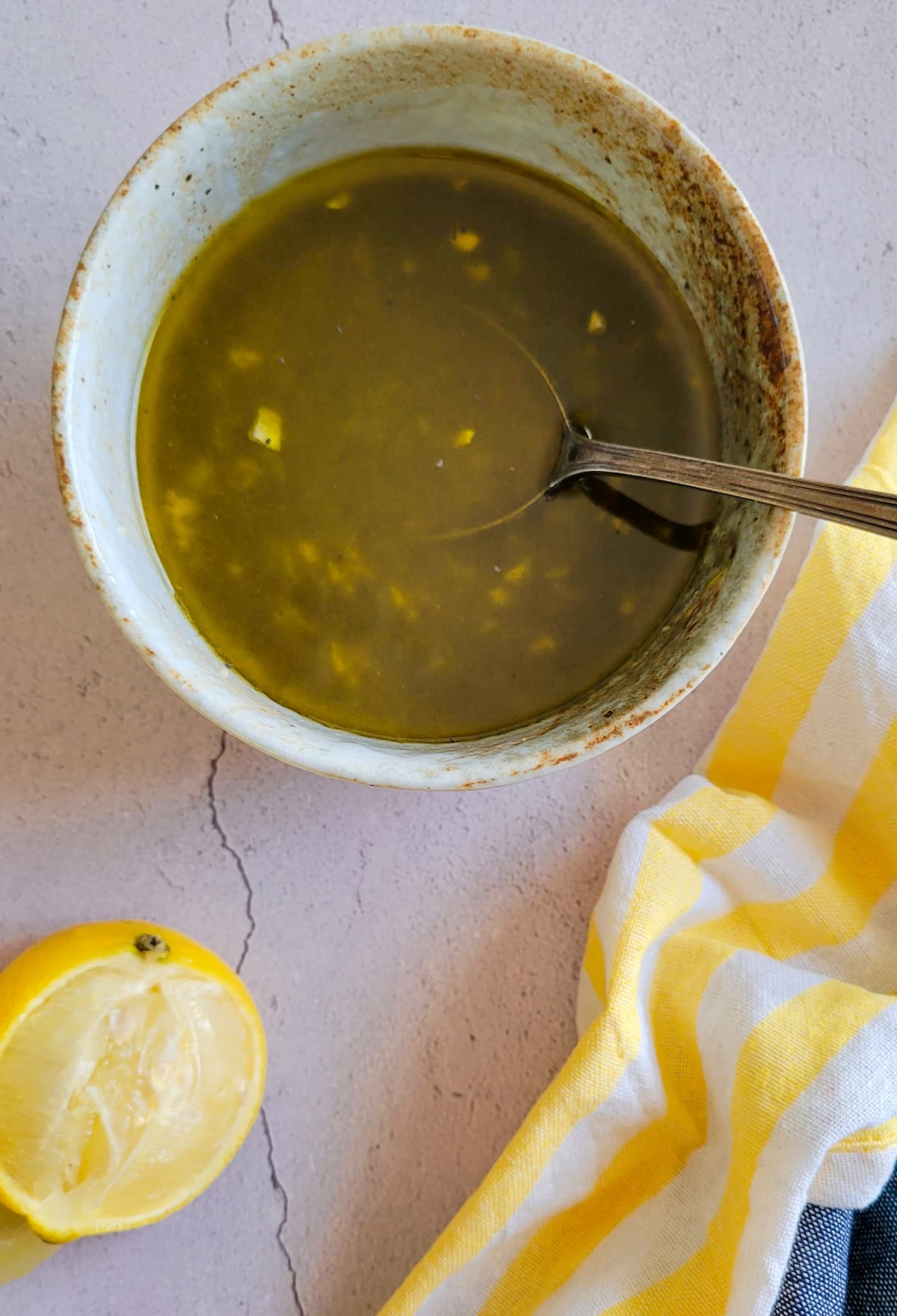lemon poppy seed dressing in a bowl with a spoon