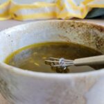 poppy seed dressing in a bowl with a whisk
