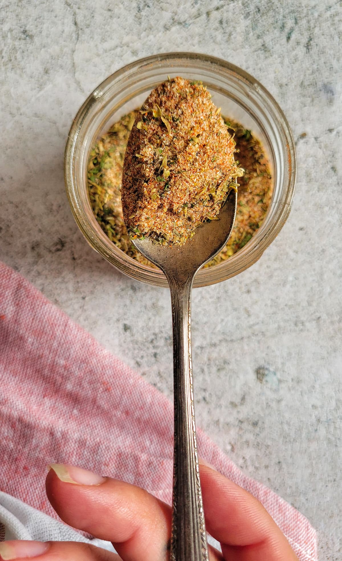 spoonful of spices over a jar of the rest of it