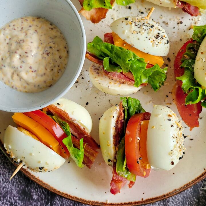 blt egg bites on a plate with grainy mayo