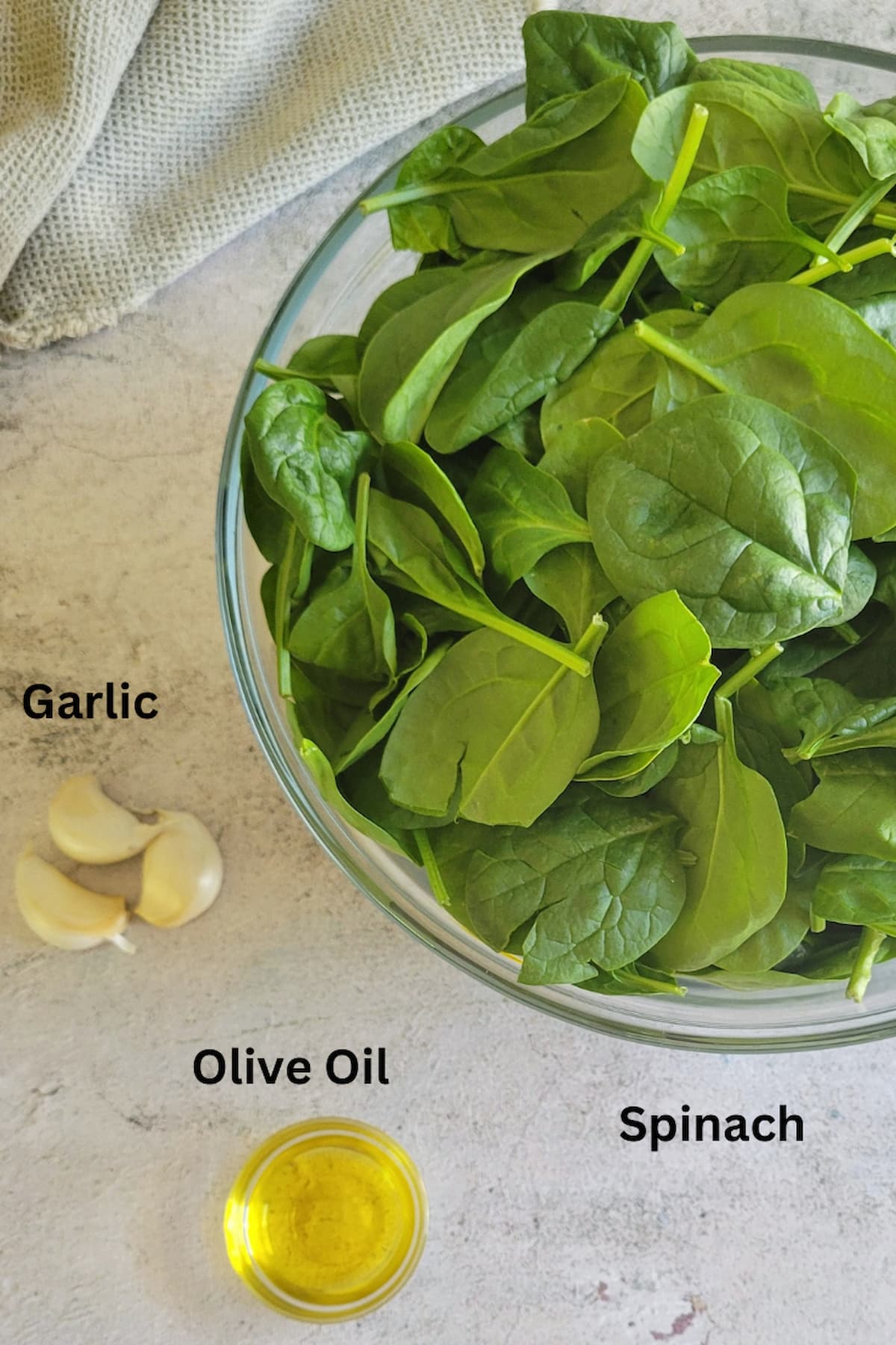 ingredients for sauteed spinach - spinach, garlic, olive oil