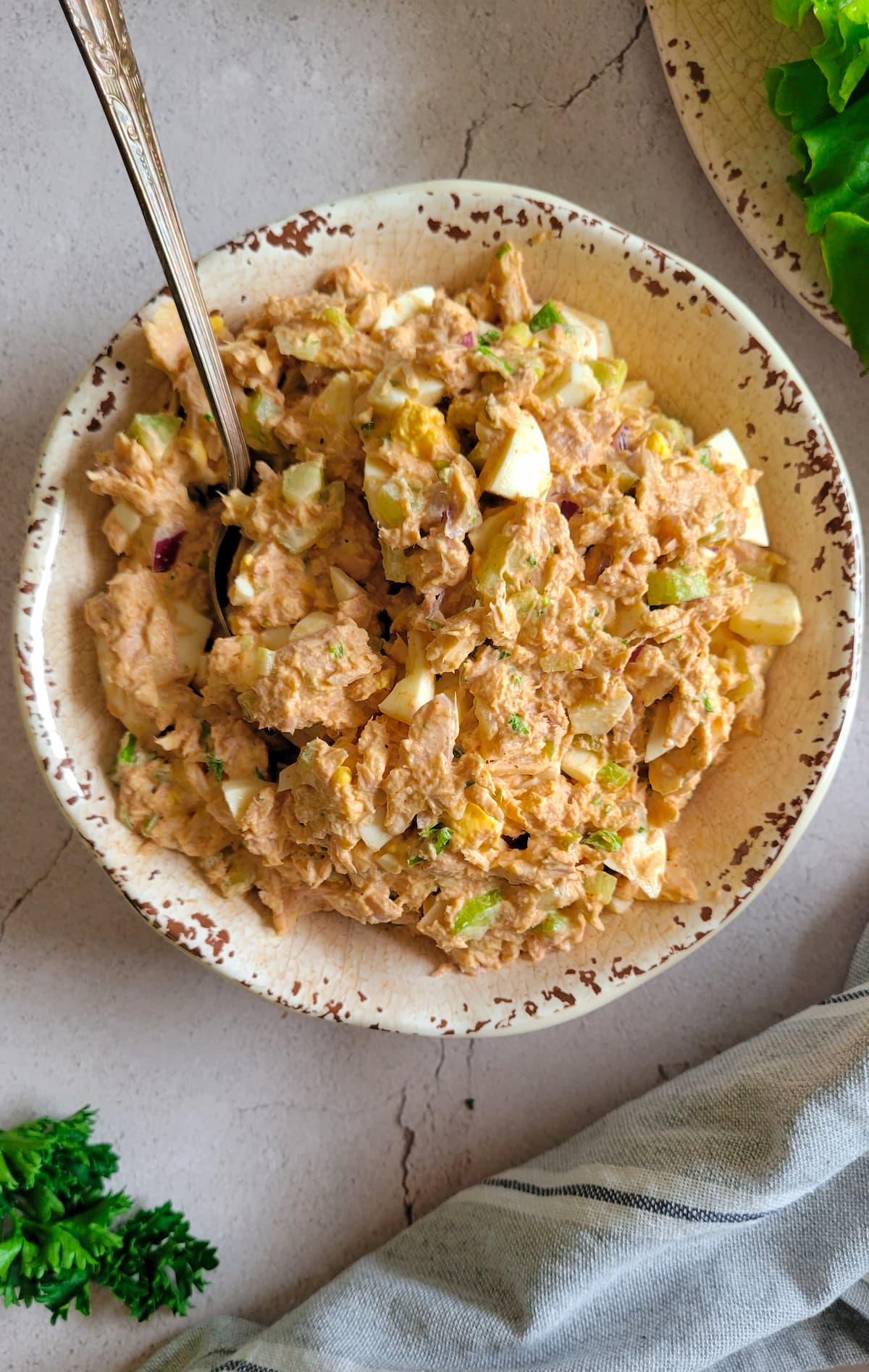 tuna egg salad in a bowl with a spoon