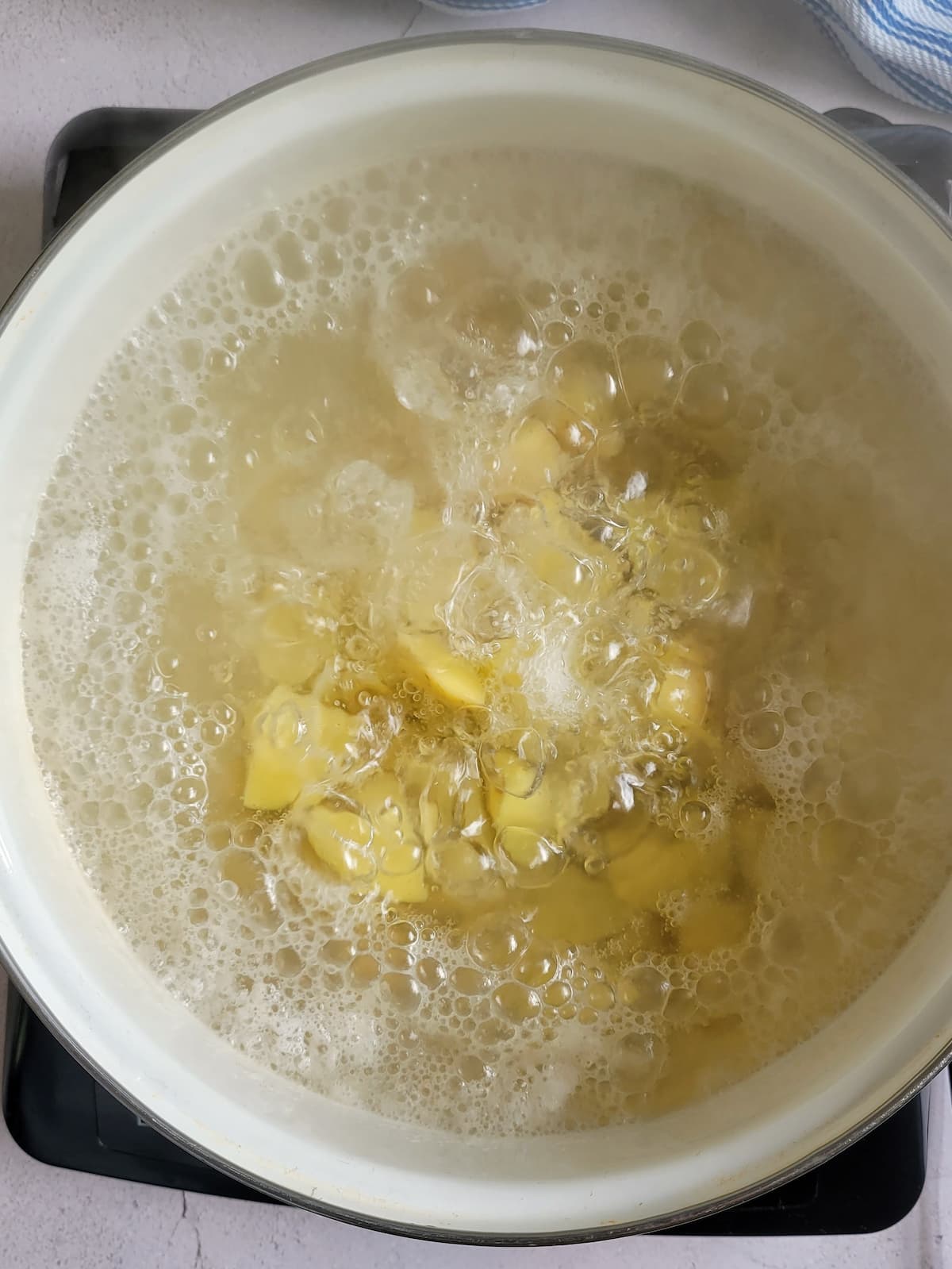 chunks of potatoes in boiling water