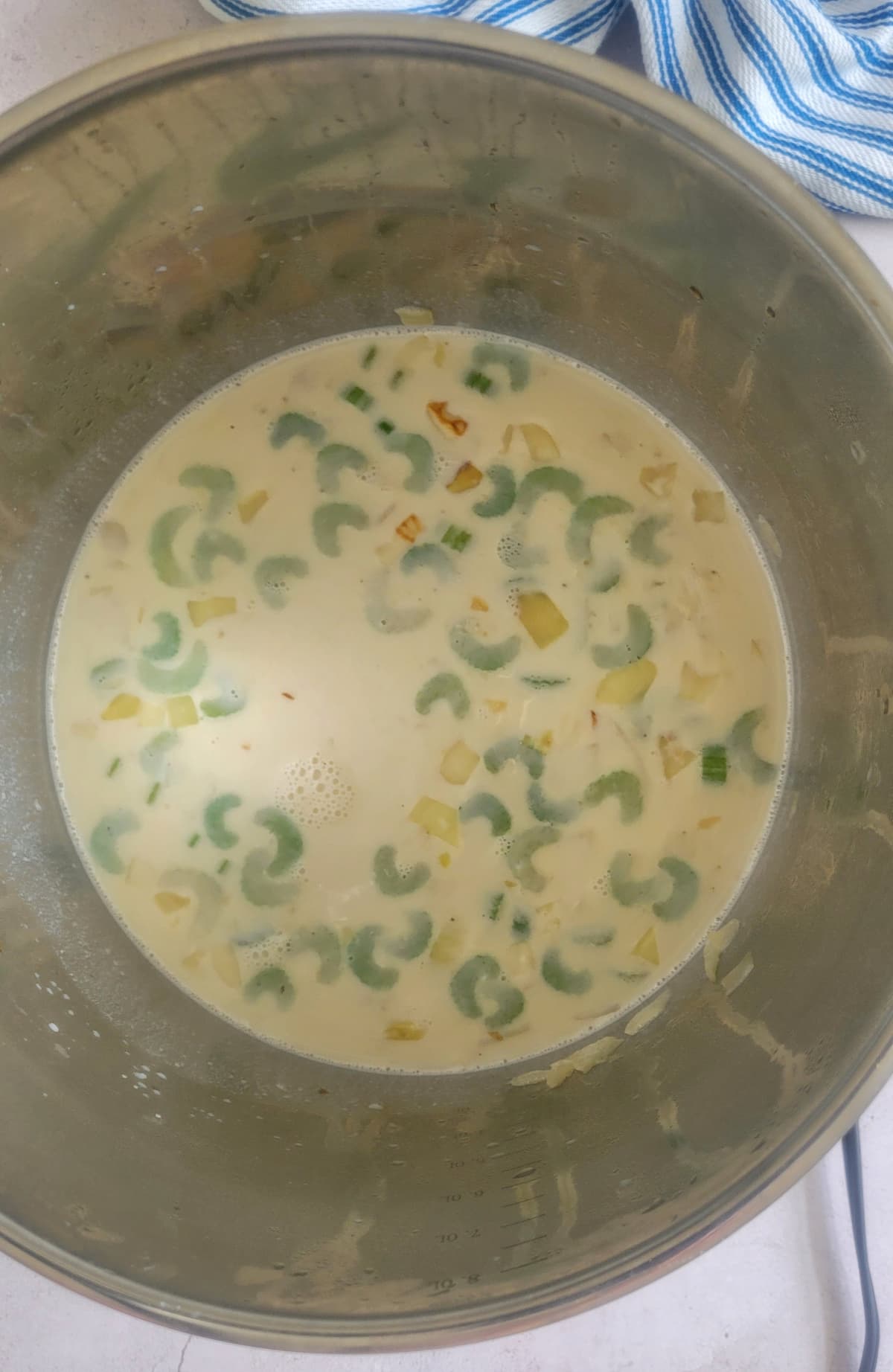 diced celery and veggies in a pot with cream
