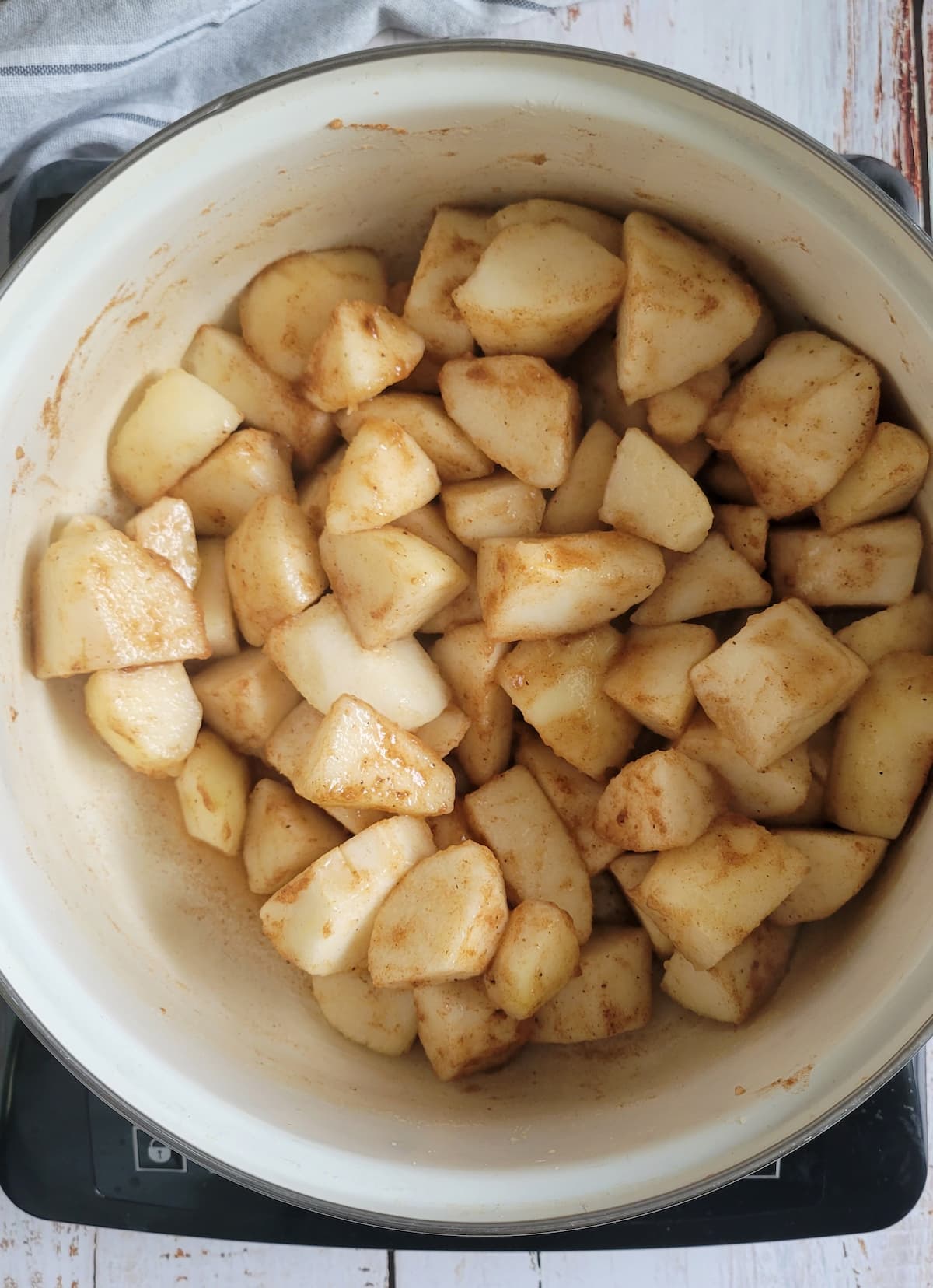 pear chunks in a pot with cinnamon