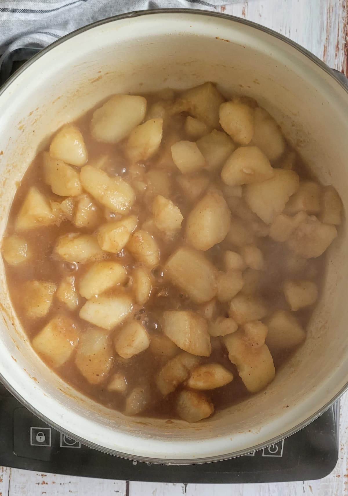 chunks of pear cooking in a pot