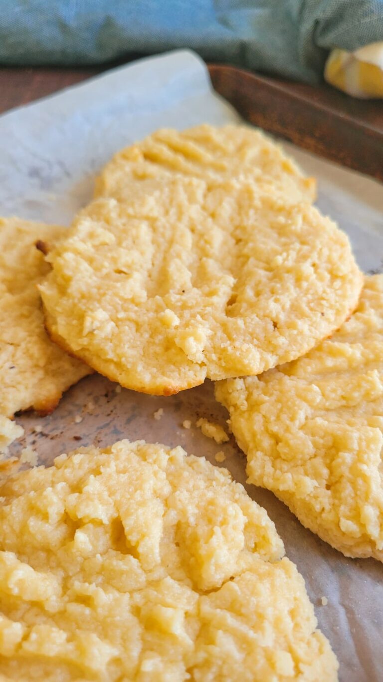 5 cookies layered on a parchment lined baking sheet