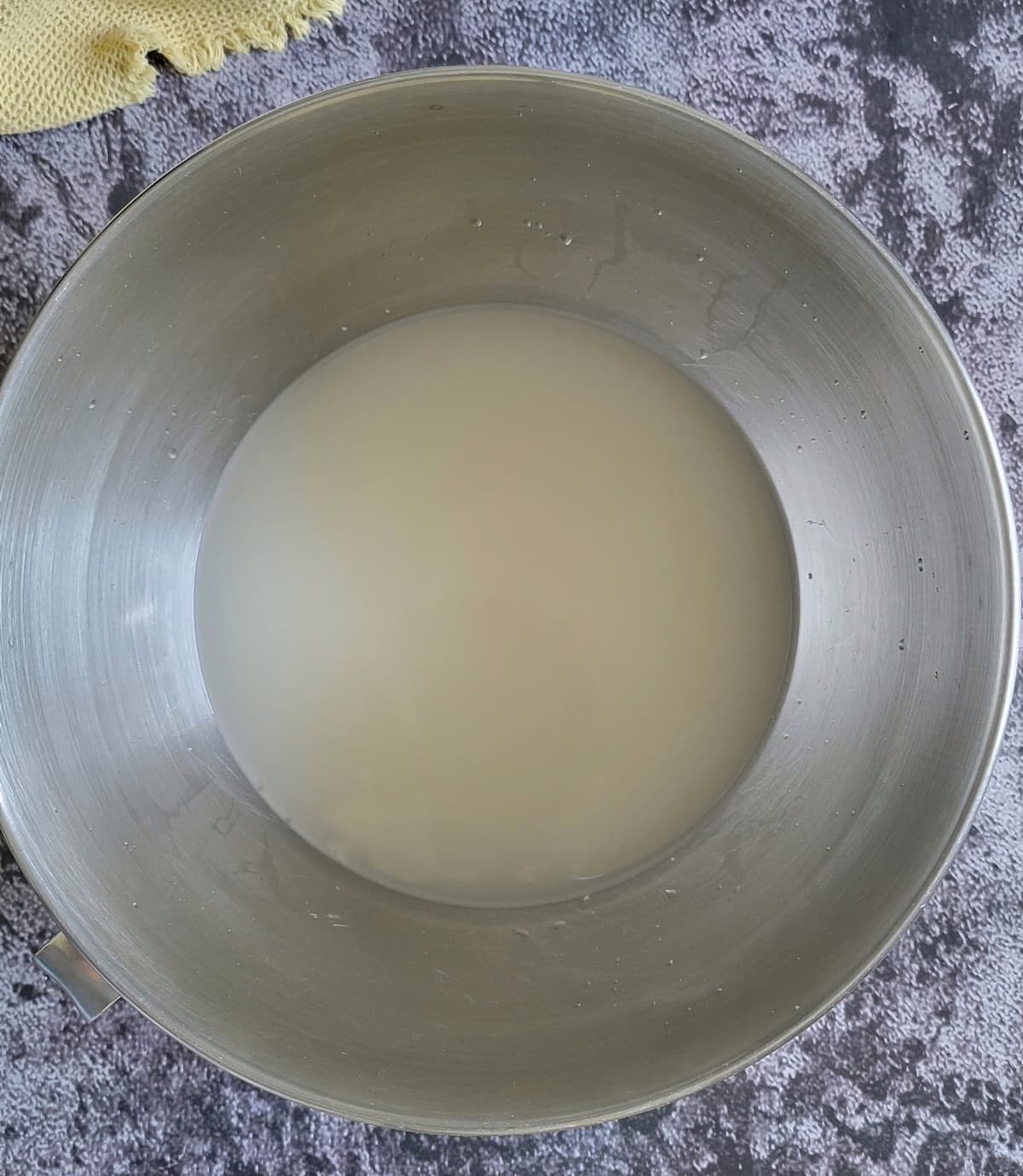 yeast proofing in water in a bowl