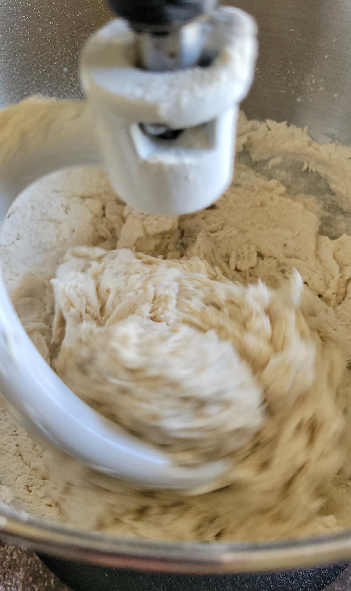 kitchenaid with a dough hook spinning dough