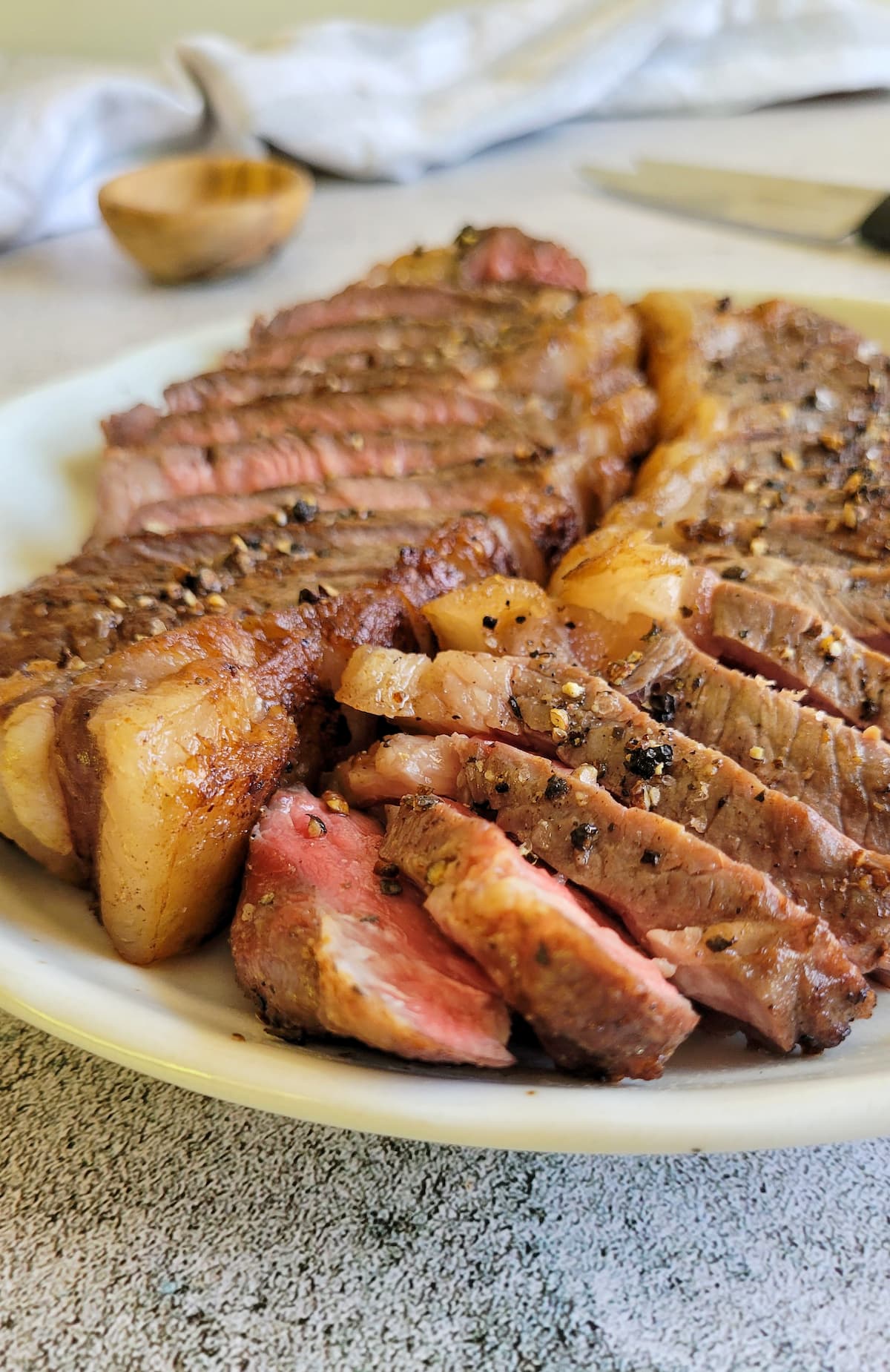 side view of two sliced steaks on a plate