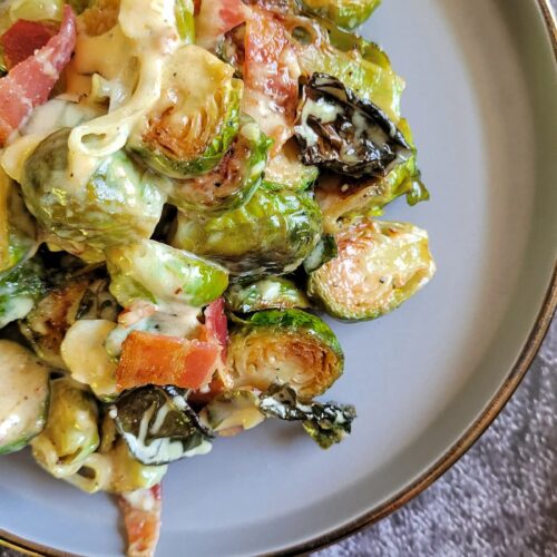 creamy brussels sprouts and bacon on a plate