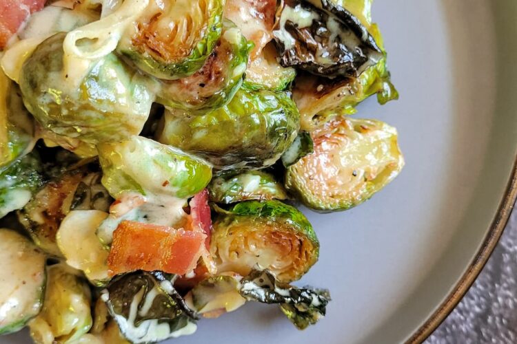 creamy brussels sprouts and bacon on a plate