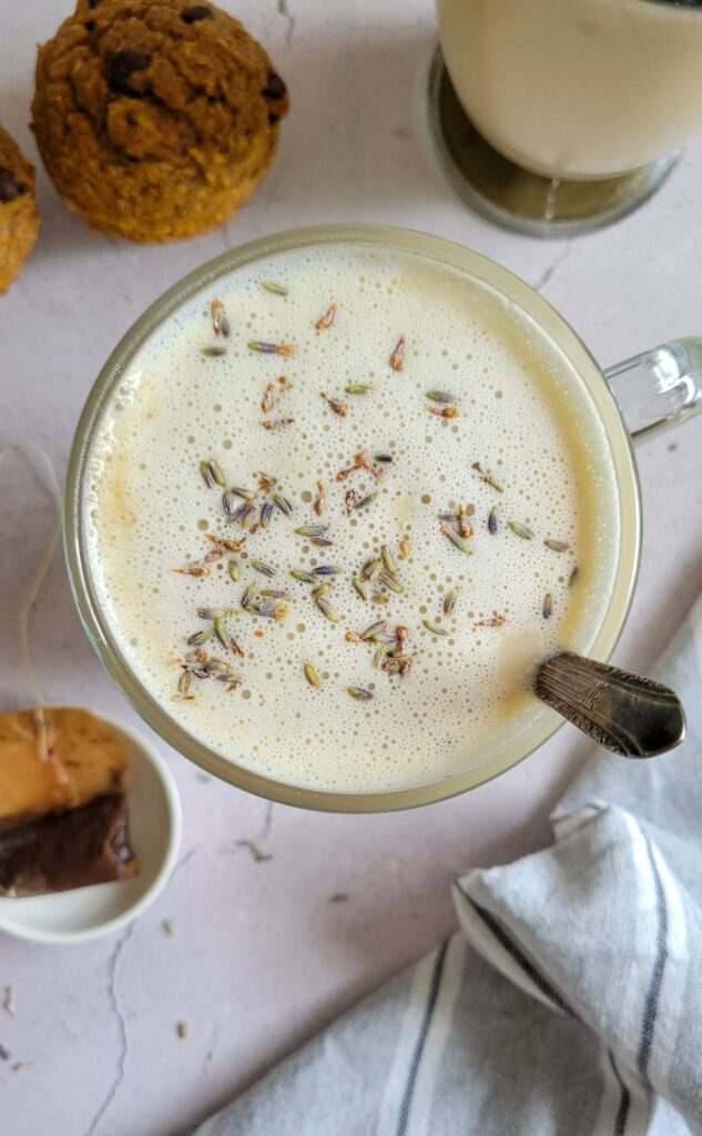 london fog with a spoon in it, muffins with another london fog and tea bag in the background