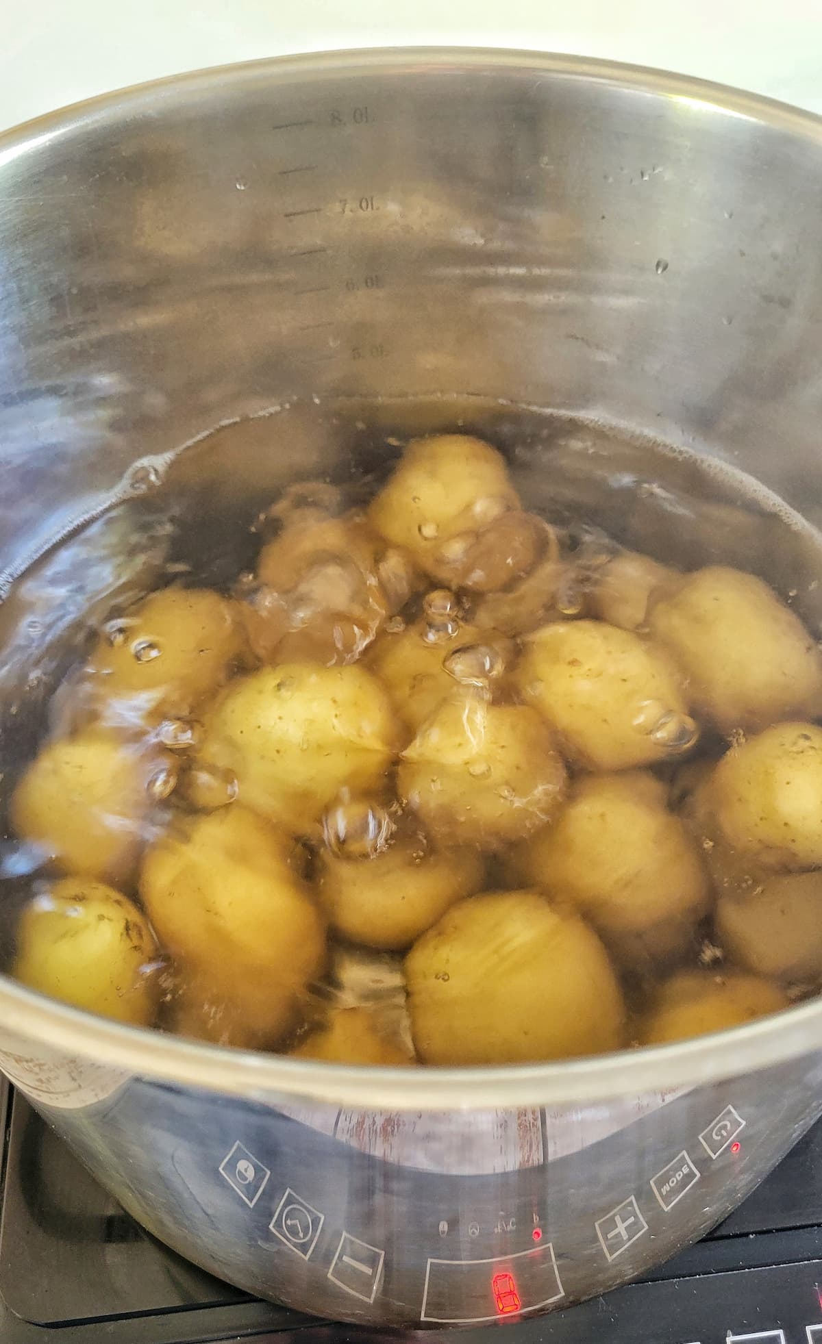 baby potatoes boiling in a pot
