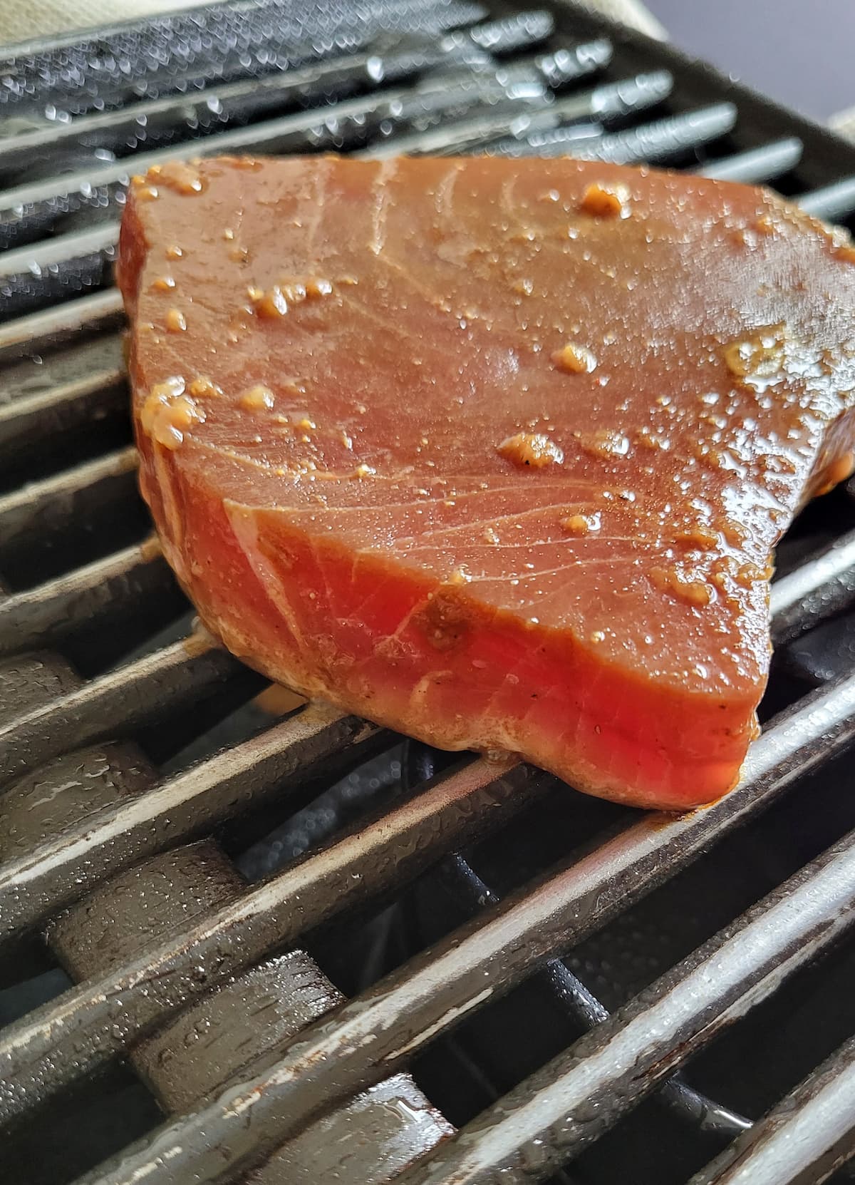 raw tuna steak on a grill