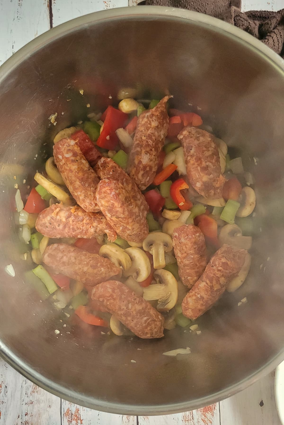 veggies and sausage cooking in a pot