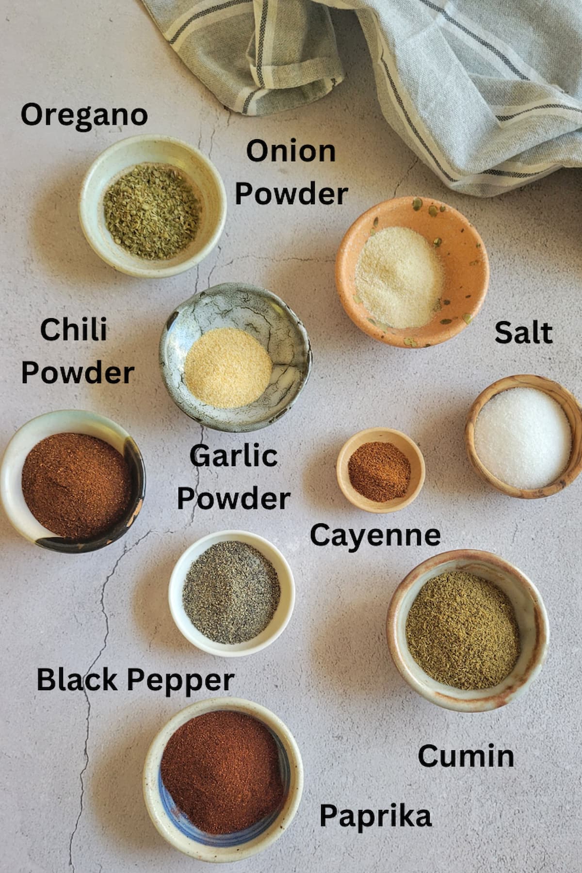 ingredients for recipe for taco seasoning mix - paprika, chili powder, garlic powder, onion powder, cayenne, black pepper, salt, oregano