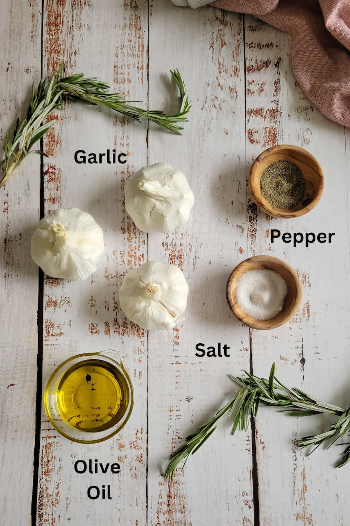 ingredients for roasted garlic in oven - garlic, salt, pepper, olive oil