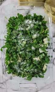 chopped swiss chard topped with salt in a dish