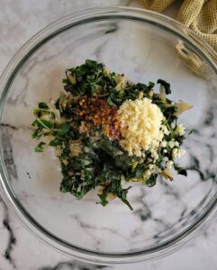chopped swiss chard, garlic, chili flakes, salt and pepper in a bowl