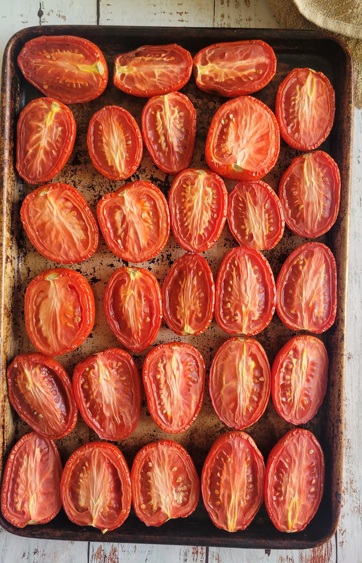 halved. tomatoes on a sheet pan