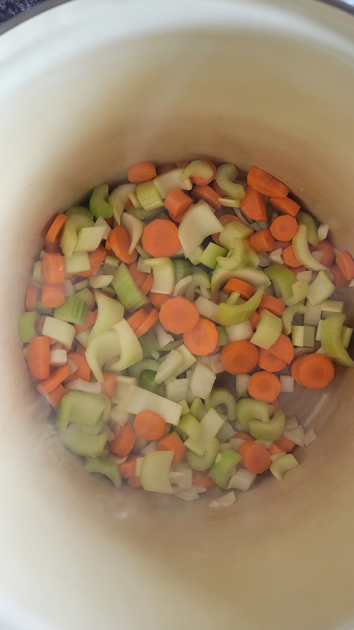 diced celery, onions and carrots in a pot