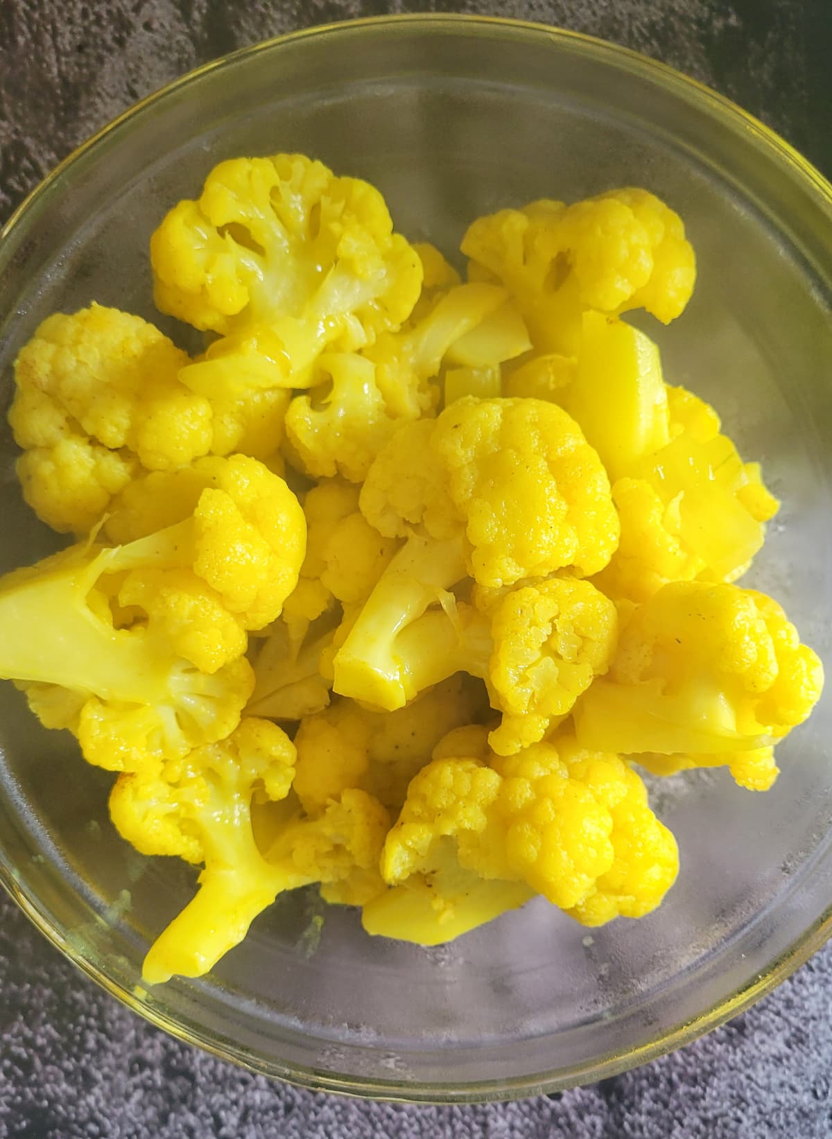 bright yellow cauliflower florets in a bowl