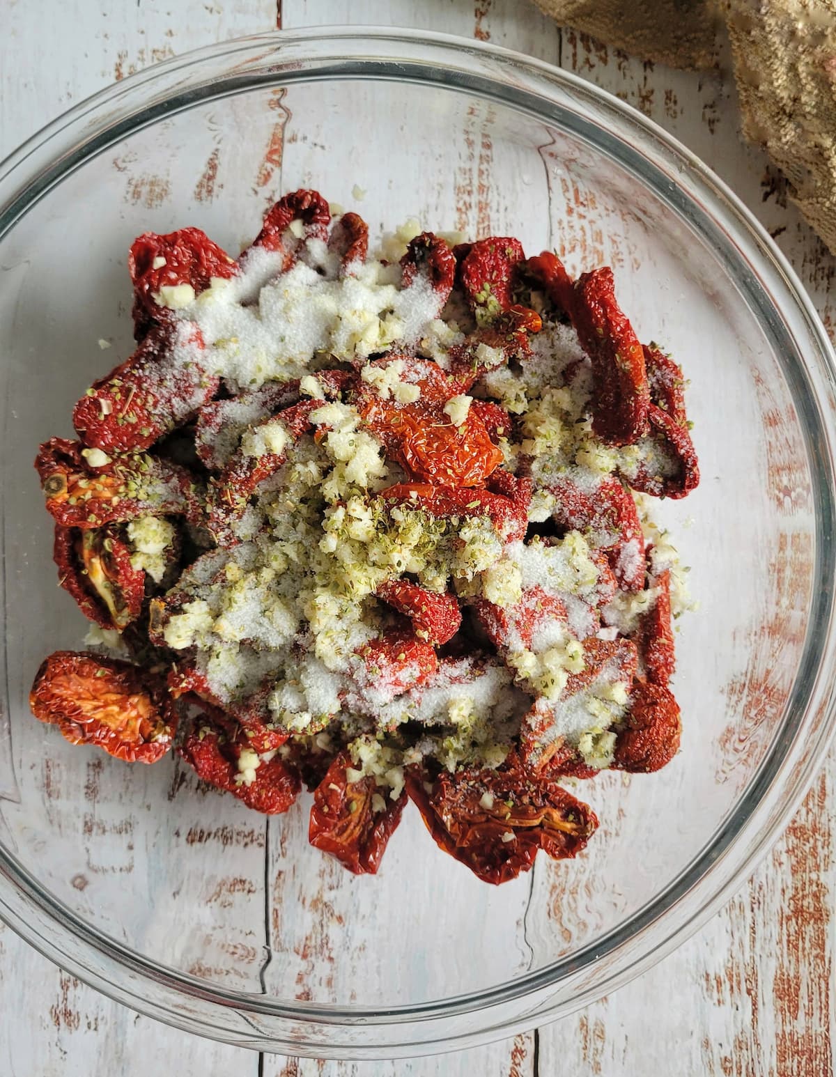 sun dried tomatoes in a bowl with garlic and spices