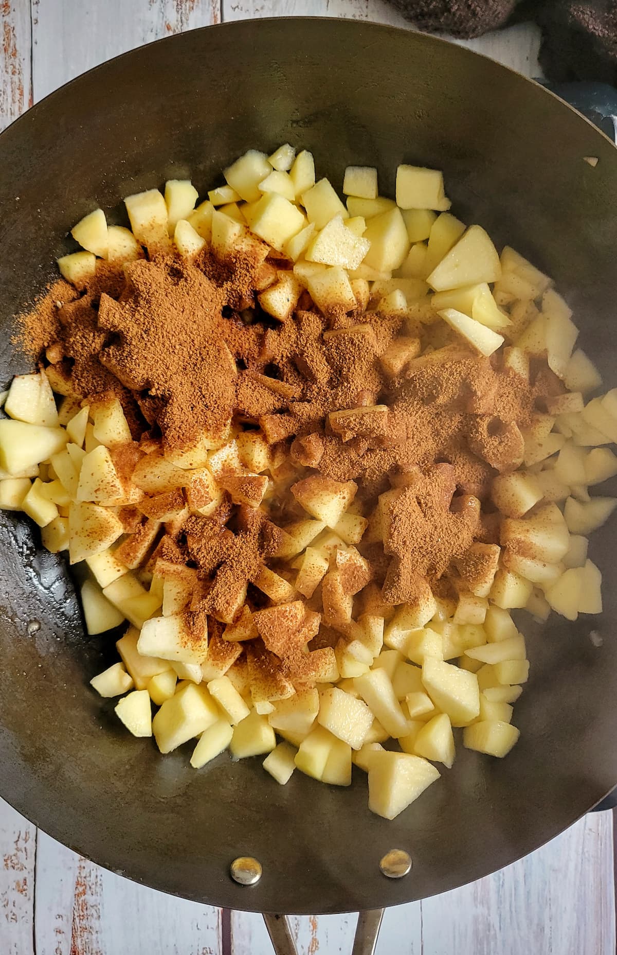 diced apples with spices in a skillet