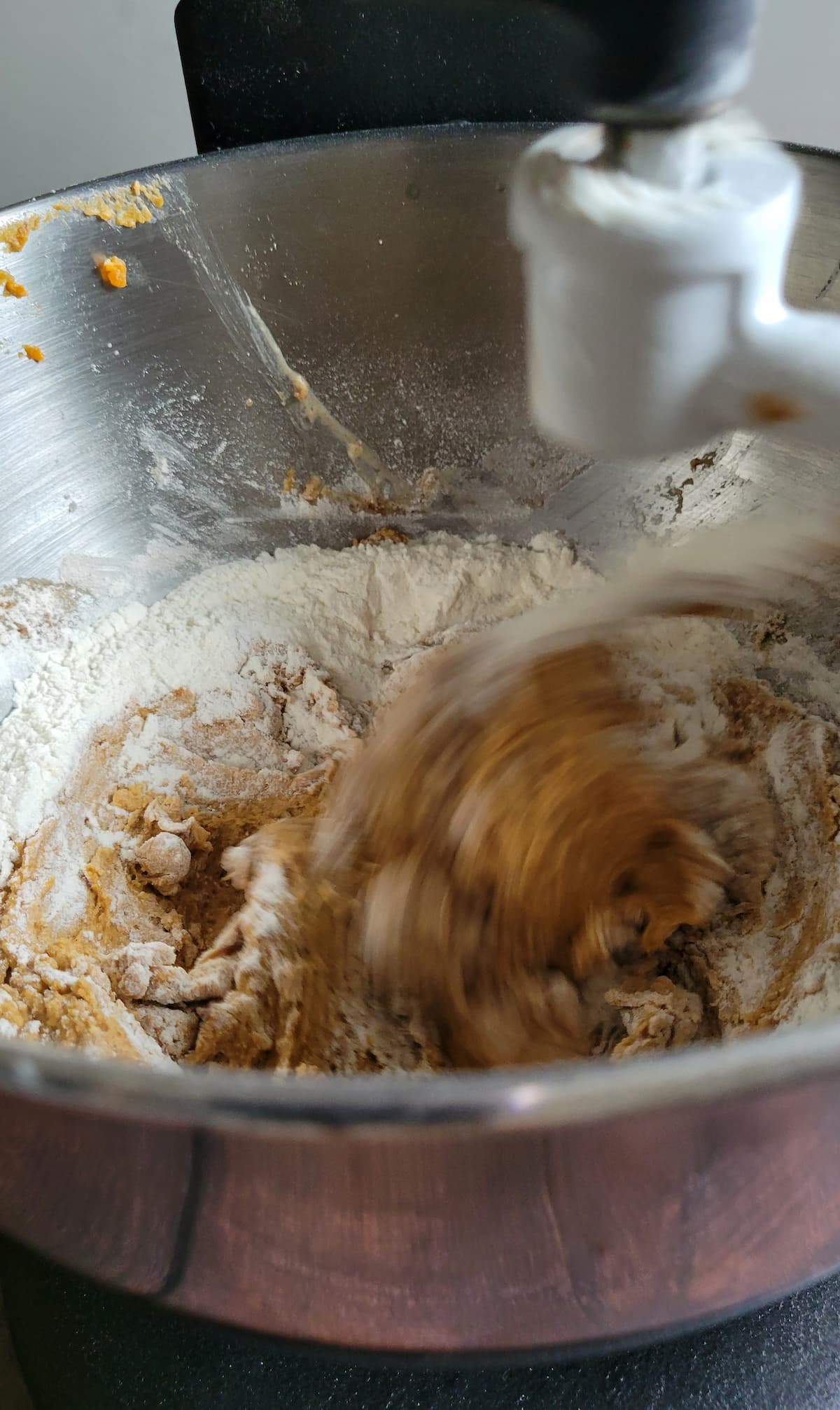 flour and other ingredients mixing in a bowl