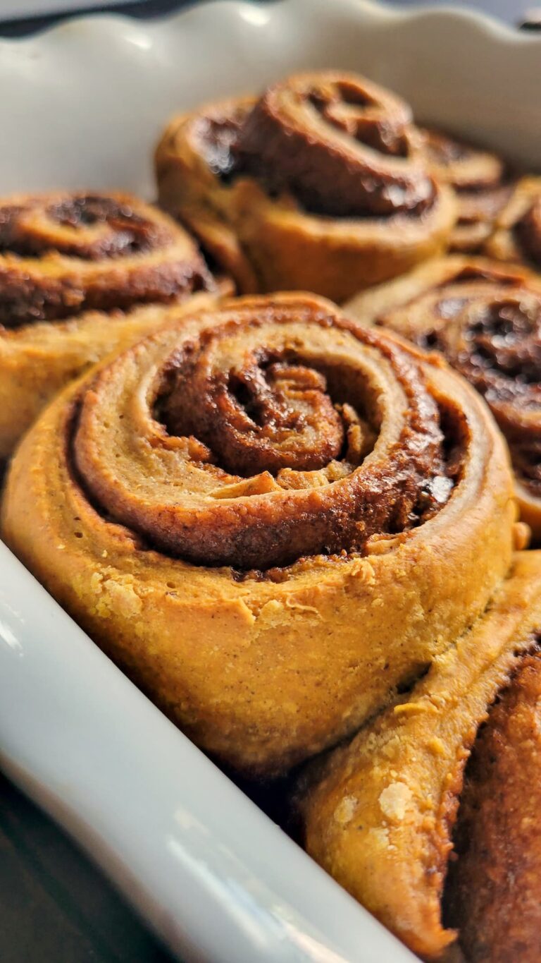 pumpkin cinnamon rolls in a tray