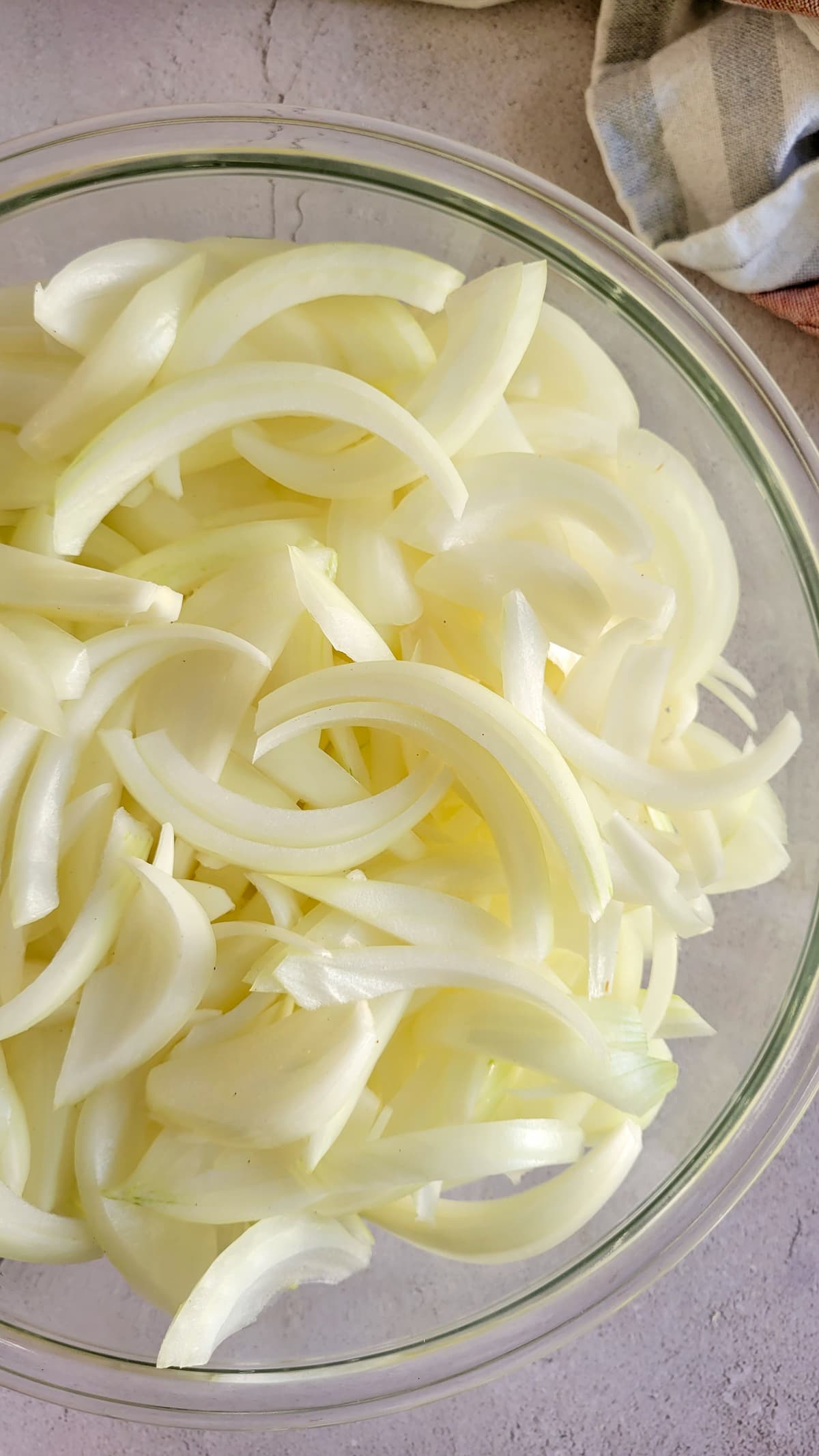 bowl of sliced white onions