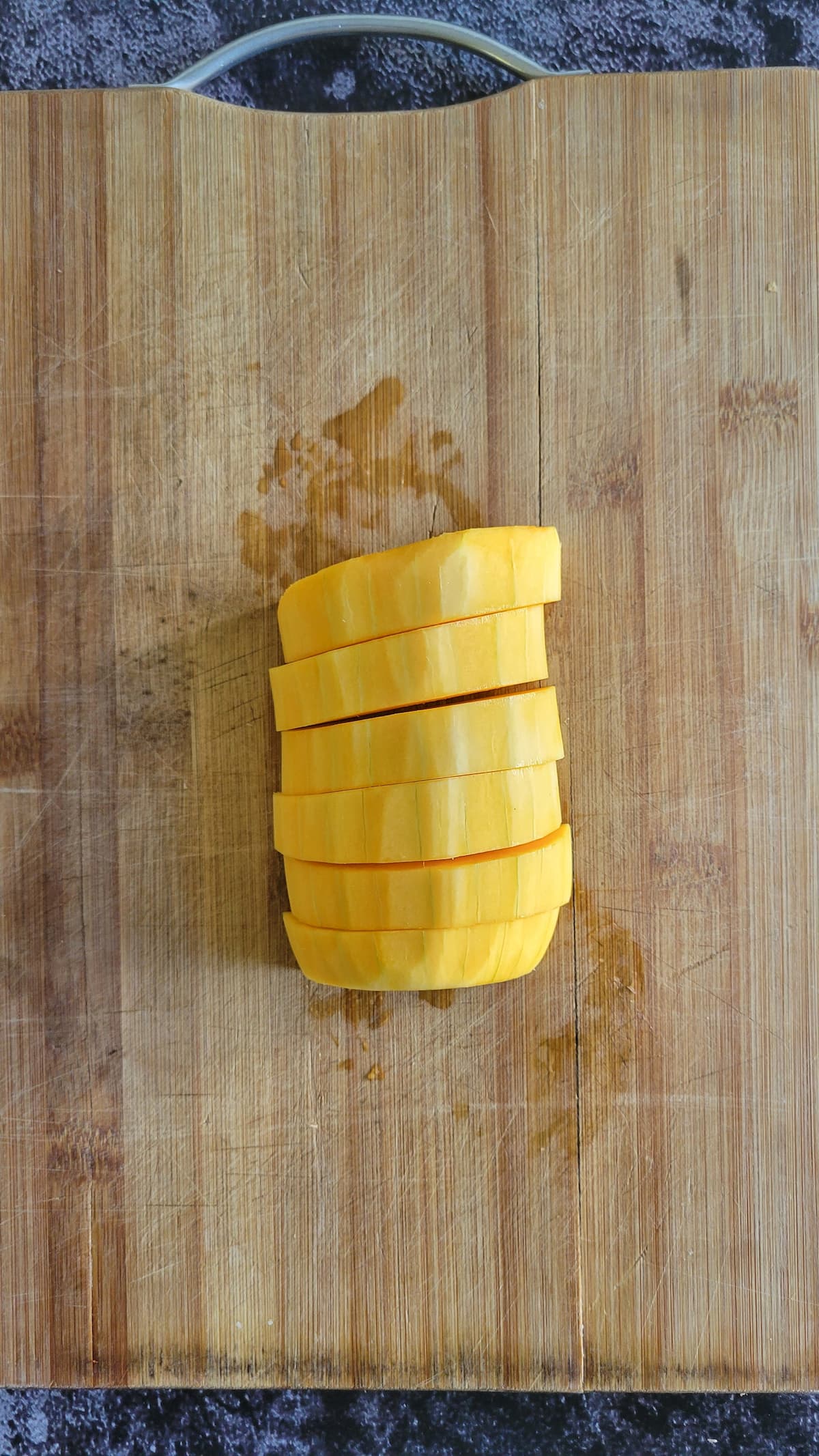 slices of butternut squash on a cutting board