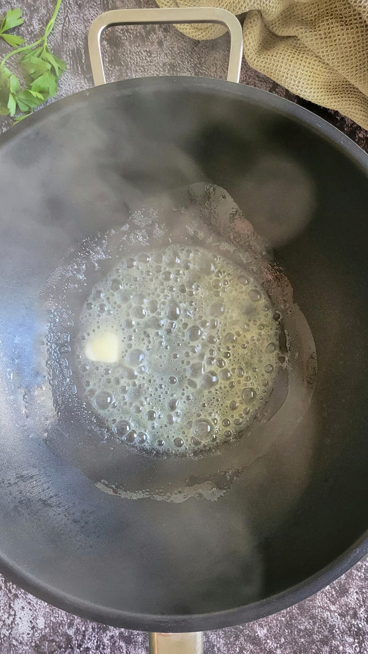 butter melting in a wok
