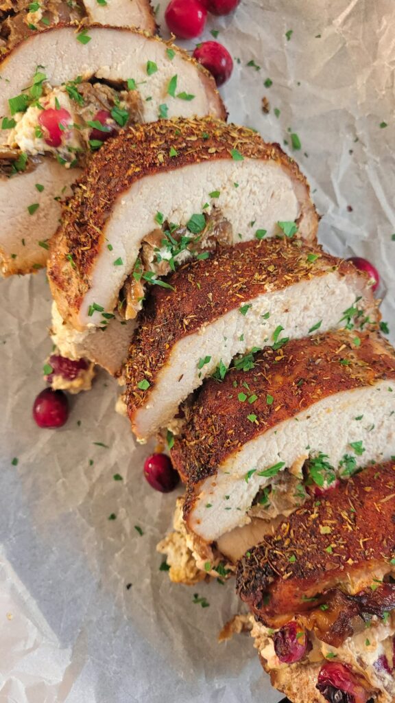 STUFFED PORK TENDERLOIN WITH CARAMELIZED ONIONS, GOAT CHEESE, AND CRANBERRIES