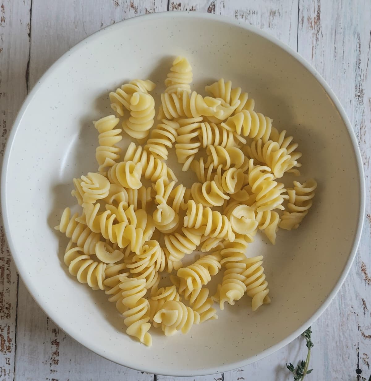 bowl of plain curly pasta