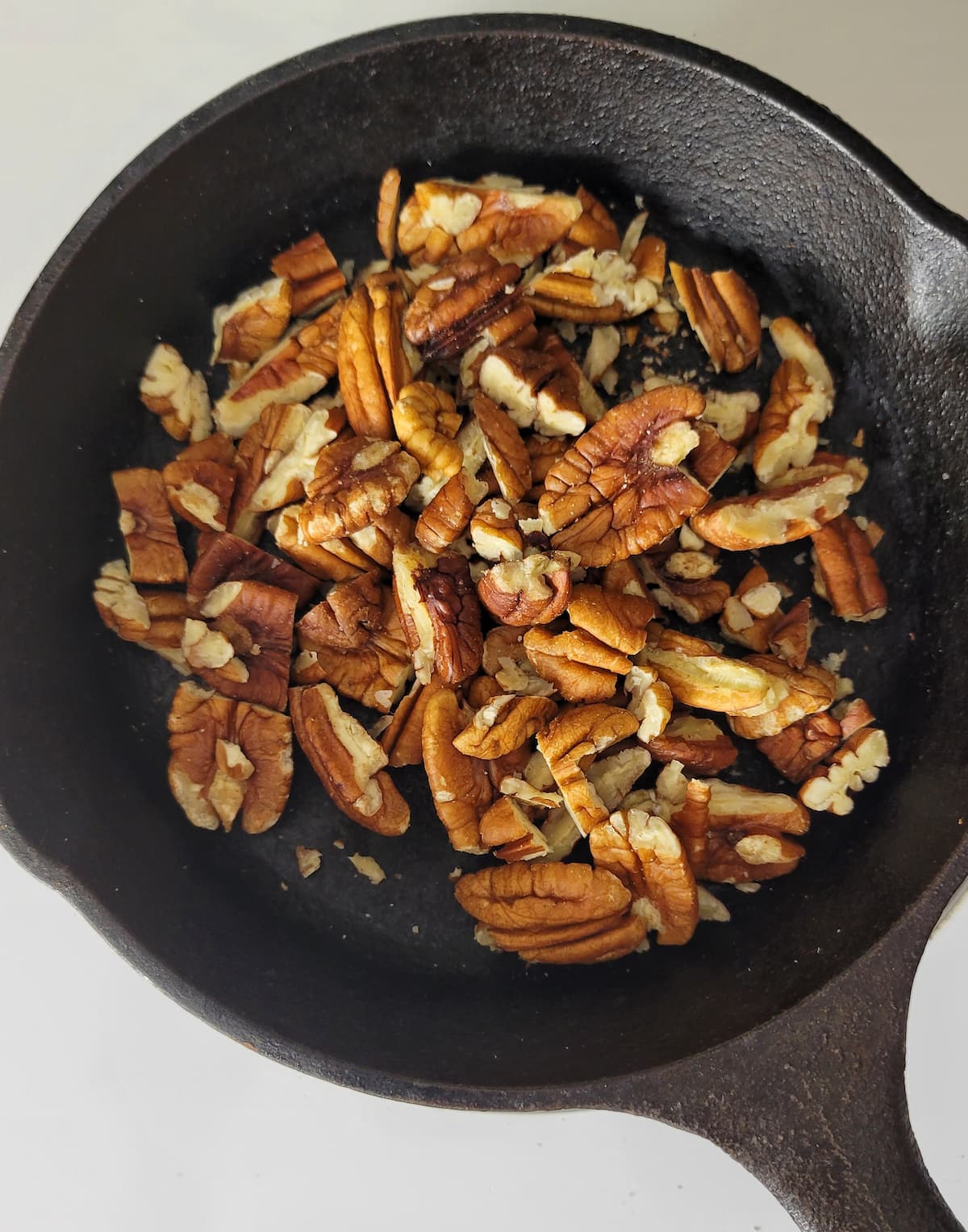 pecans in a small cast iron skillet