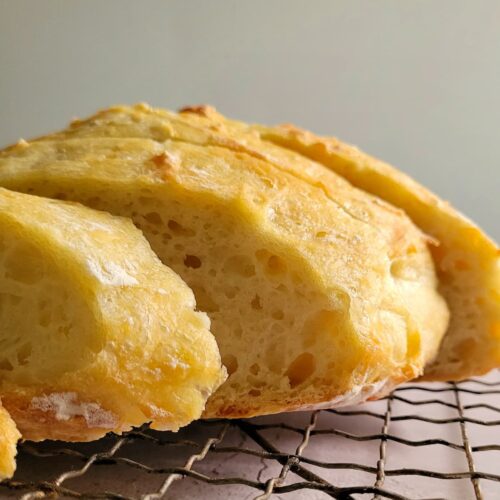 slices of fresh bread on a wire rack