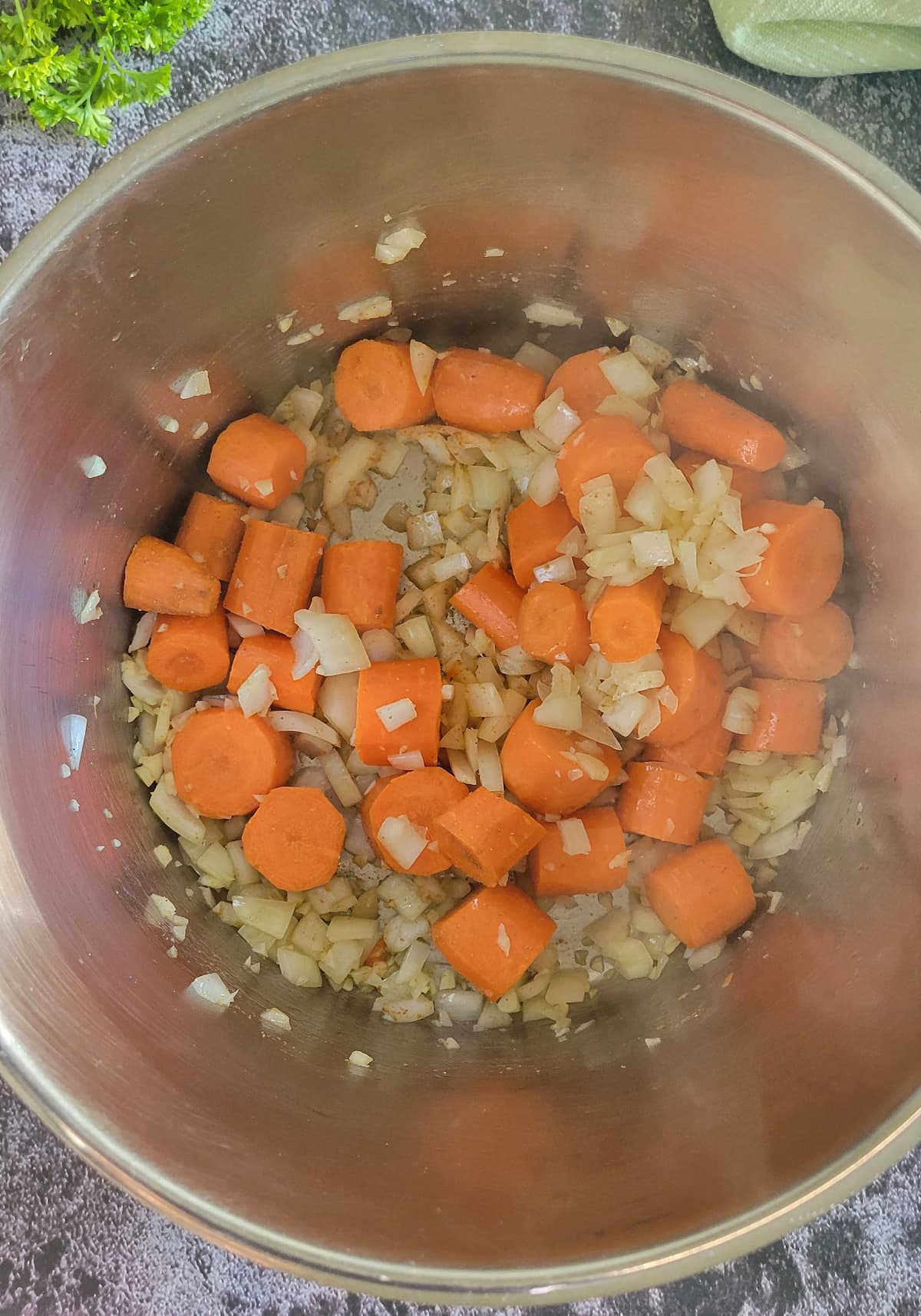 chunks of carrots, diced onions and minced garlic in a pot