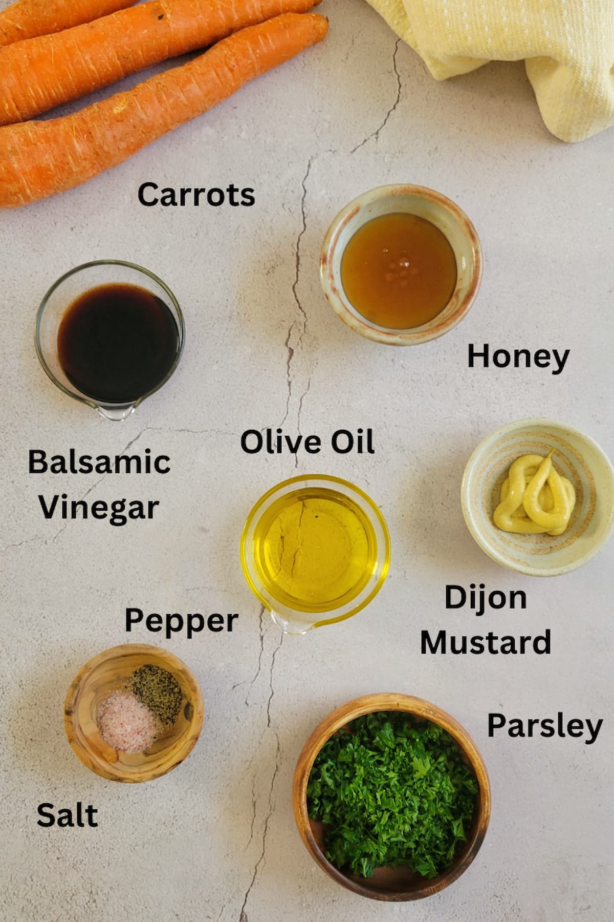 ingredients for glazed carrots recipe - carrots, dijon mustard, olive oil, balsamic vinegar, honey, parsley, salt, pepper