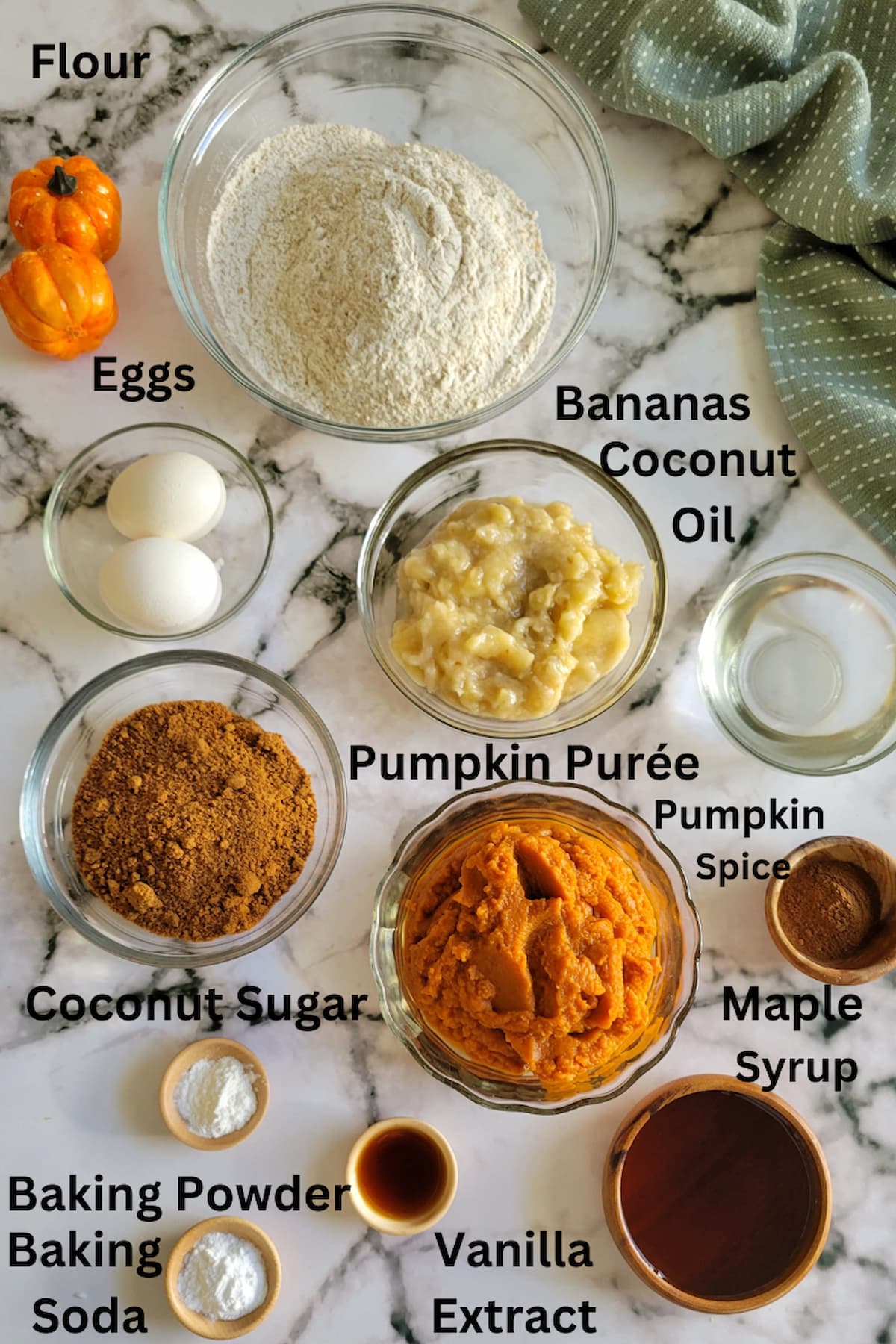 ingredients for banana bread with pumpkin - pumpkin spice, pumpkin puree, flour, bananas, coconut oil, coconut sugar, baking soda, baking powder, vanilla extract, eggs, maple syrup