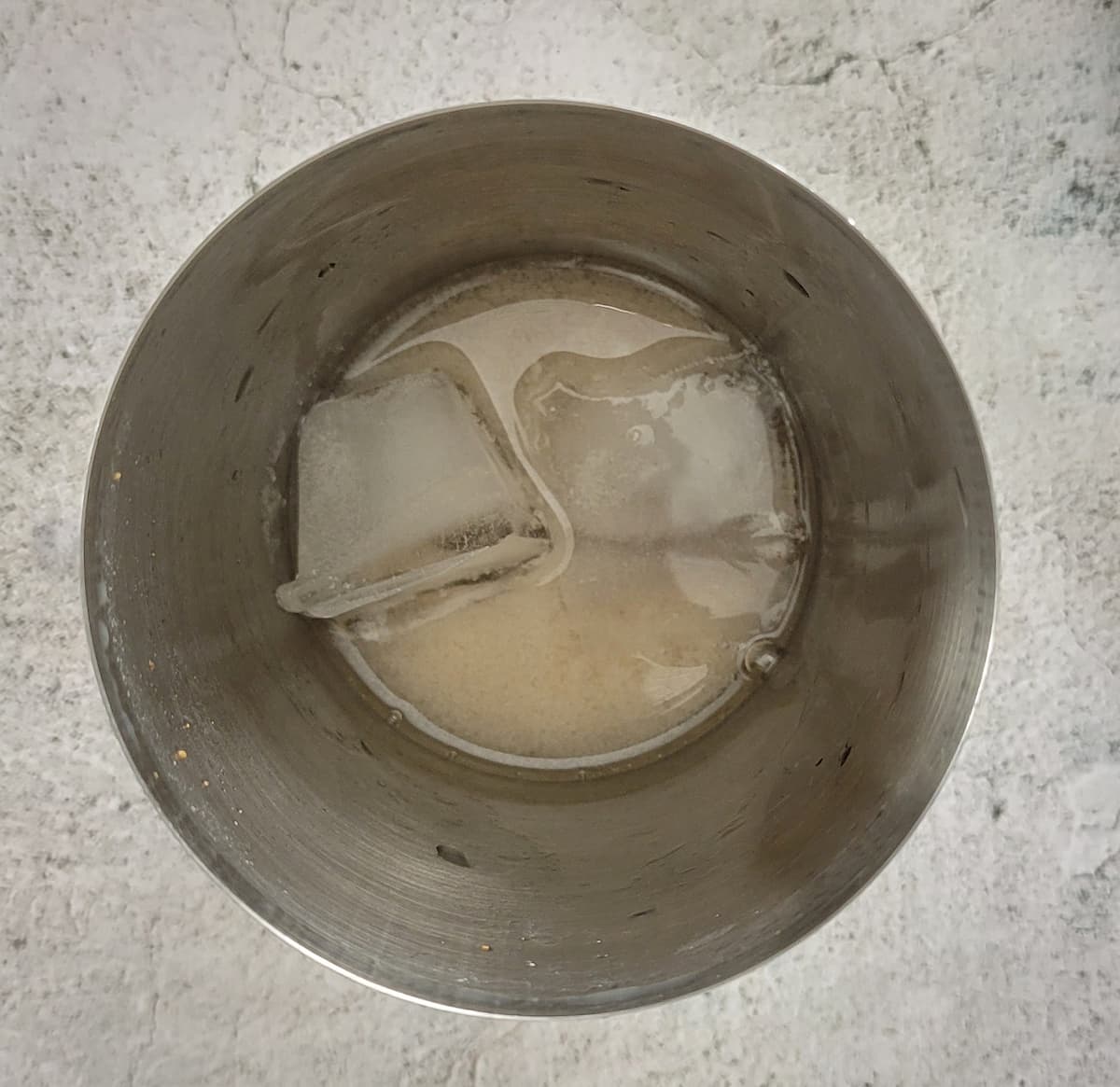 ice and creamy liquid in a martini shaker