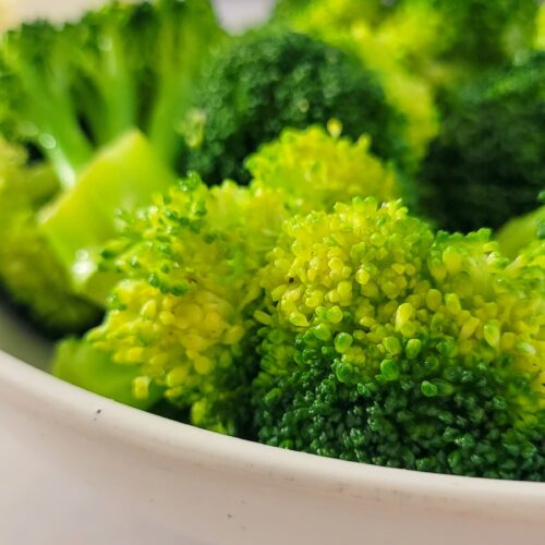 side view of broccoli in a bowl