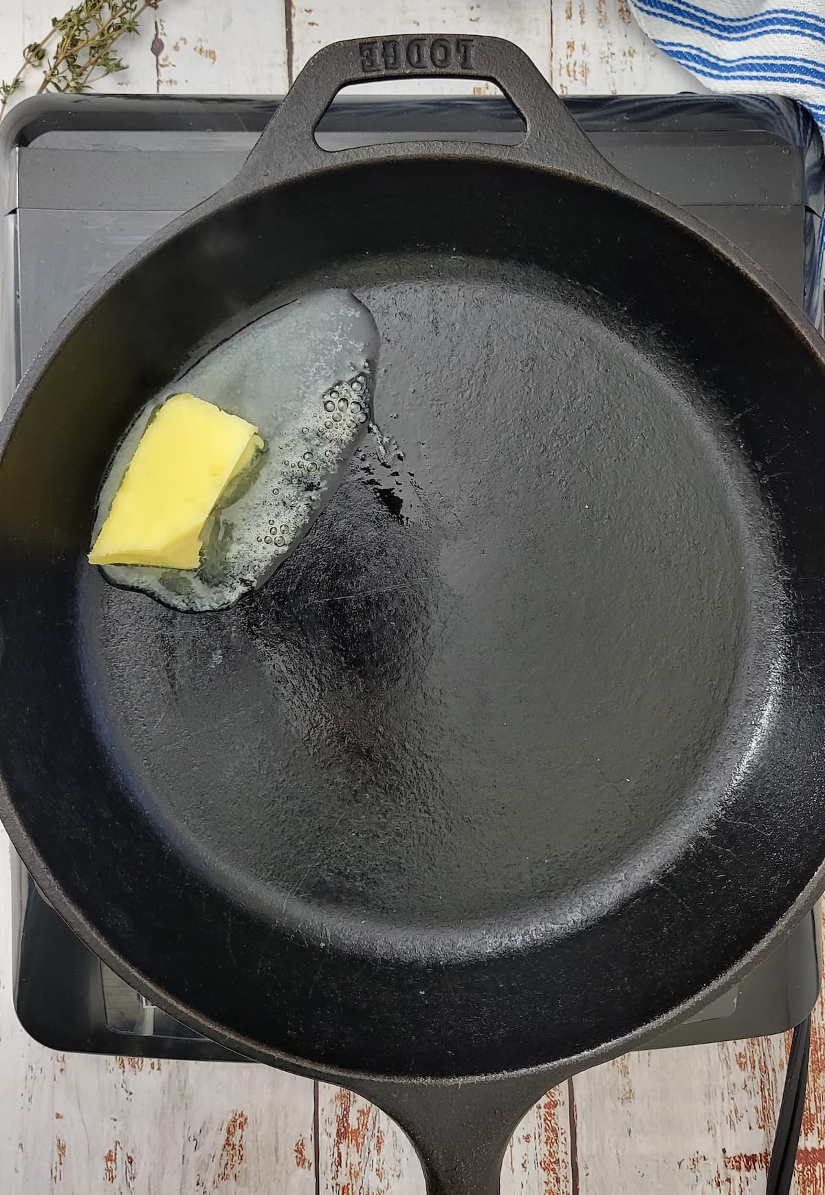 butter melting in a cast iron skillet