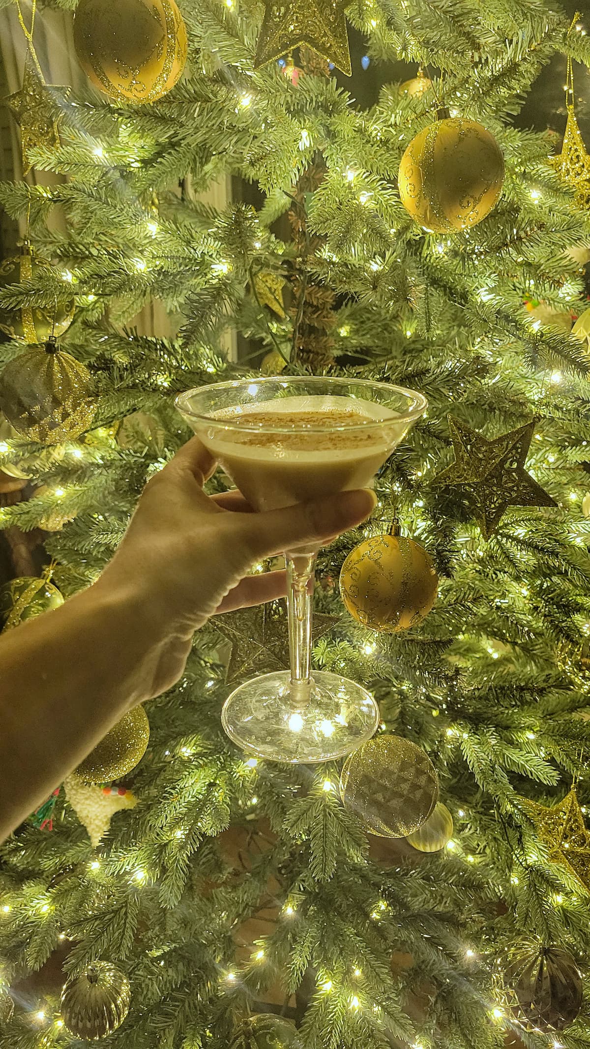 martini eggnog in front of a christmas tree