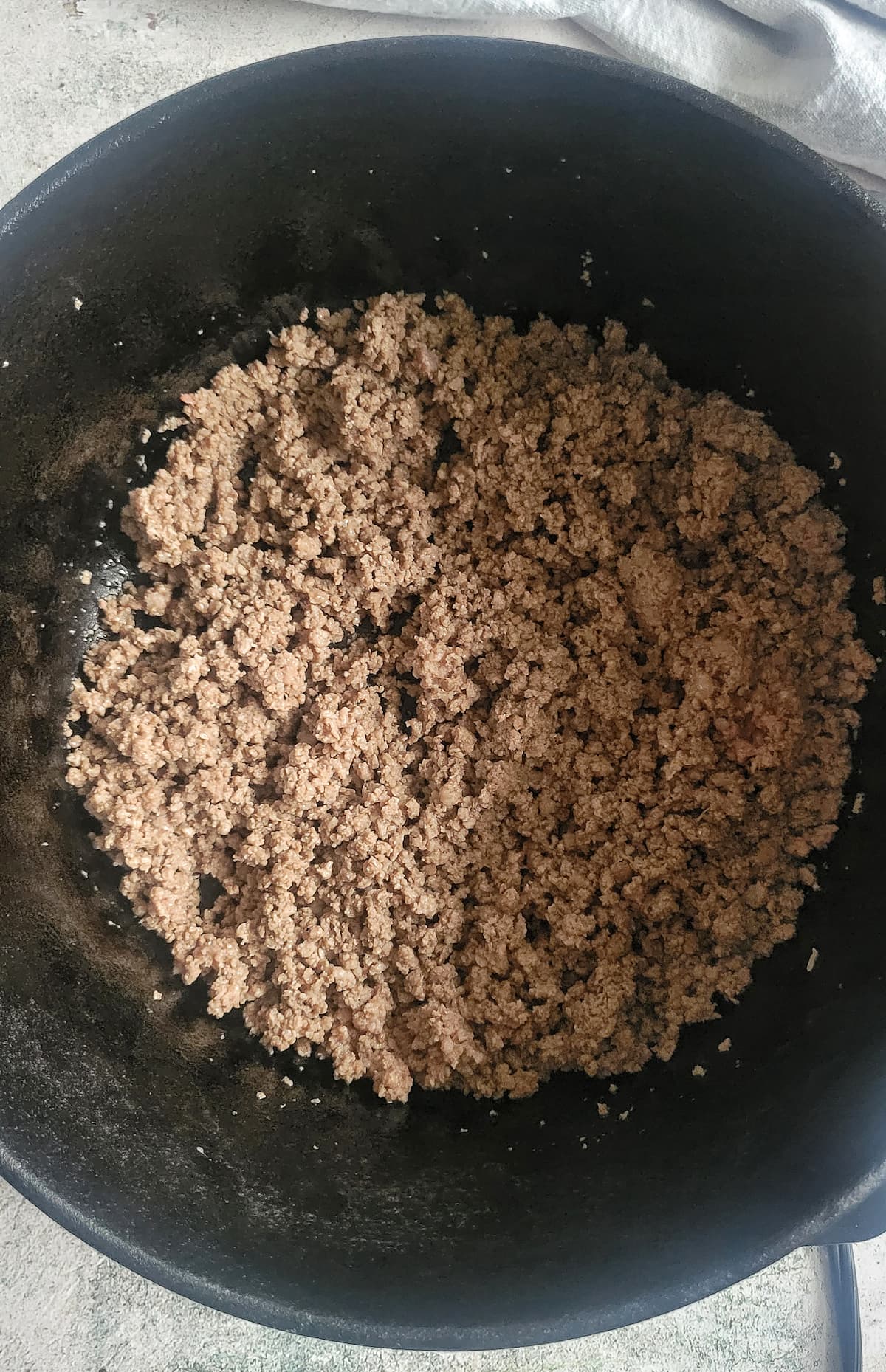 browned ground beef in a pot