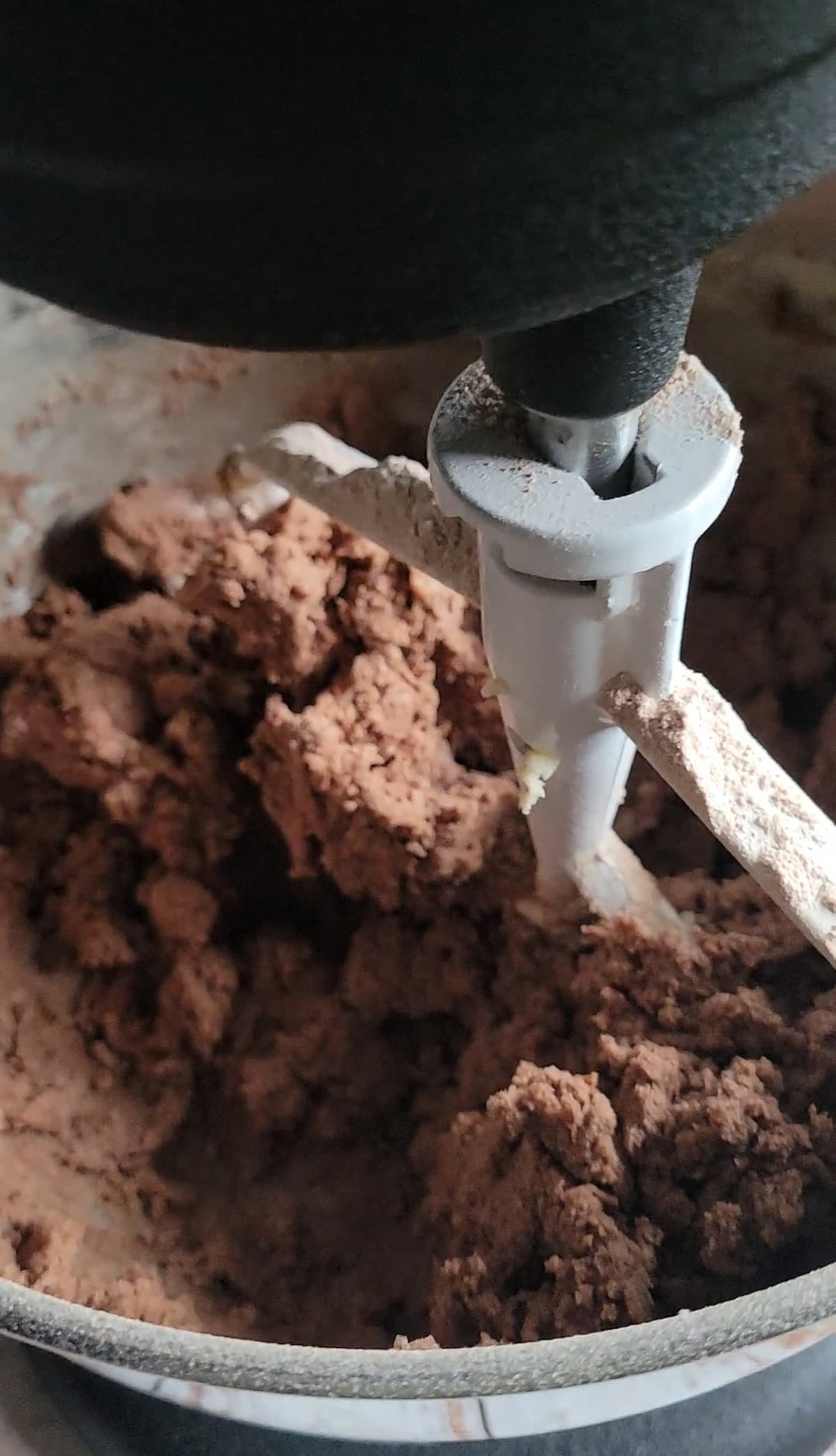 chocolate batter mixing in a stand mixer