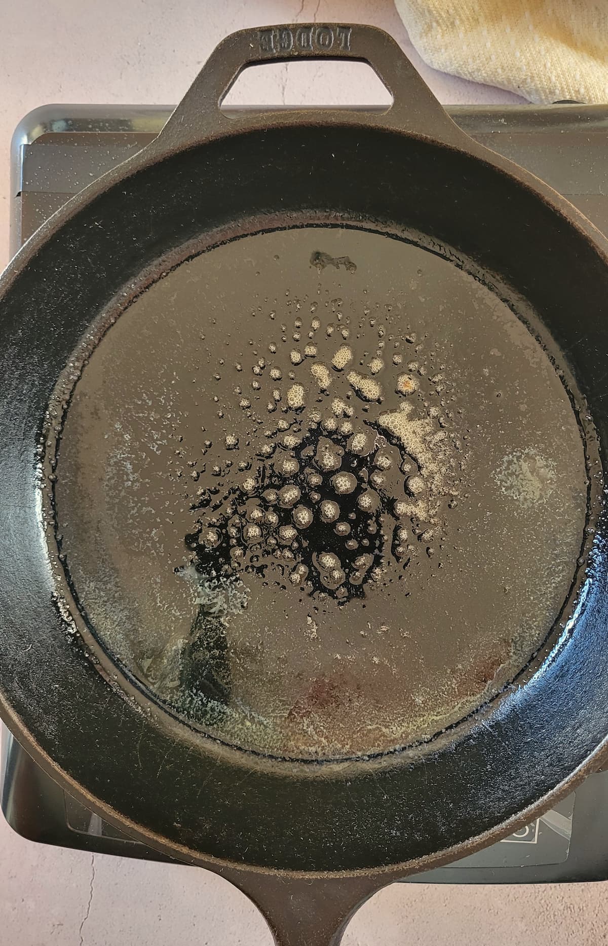 melted butter in a cast iron skillet
