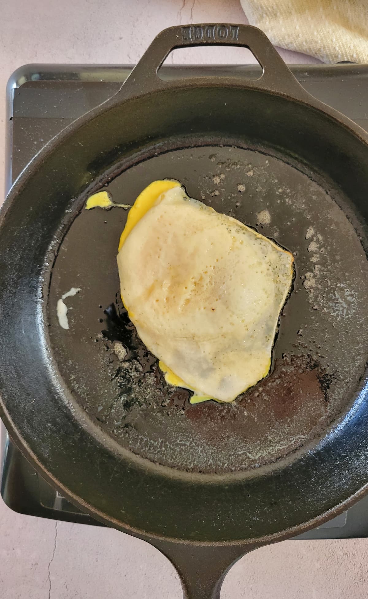 over hard egg in a cast iron skillet